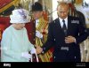 president-of-the-russian-federation-vladimir-putin-helps-the-queen-off-a-horse-drawn-carriage-...jpg