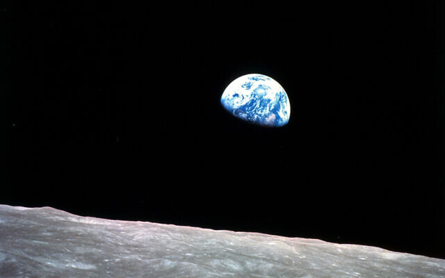 This Dec. 24, 1968, file photo made available by NASA shows the Earth behind the surface of the moon during the Apollo 8 mission (William Anders/NASA via AP, File)